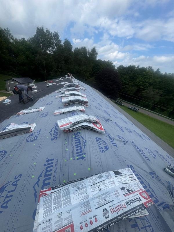 Underlayment down, shingles staged on the roof