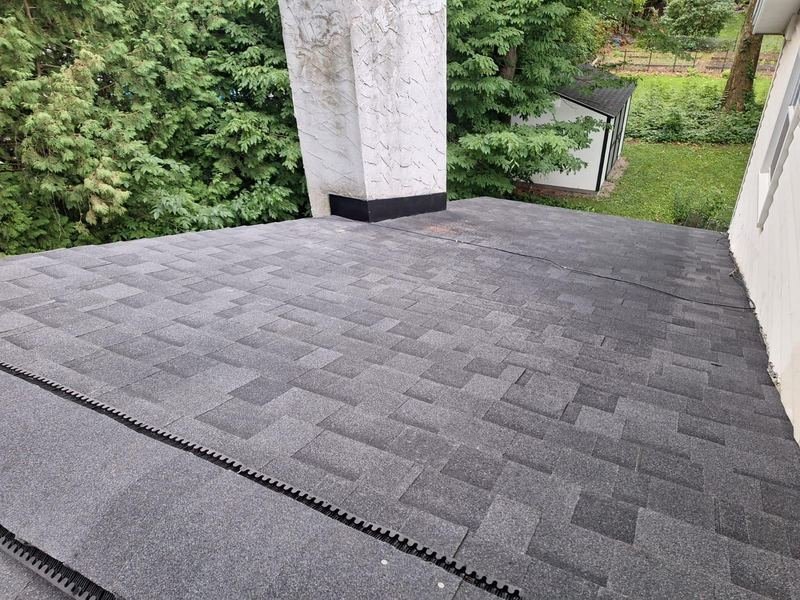 Chimney with new shingles around it