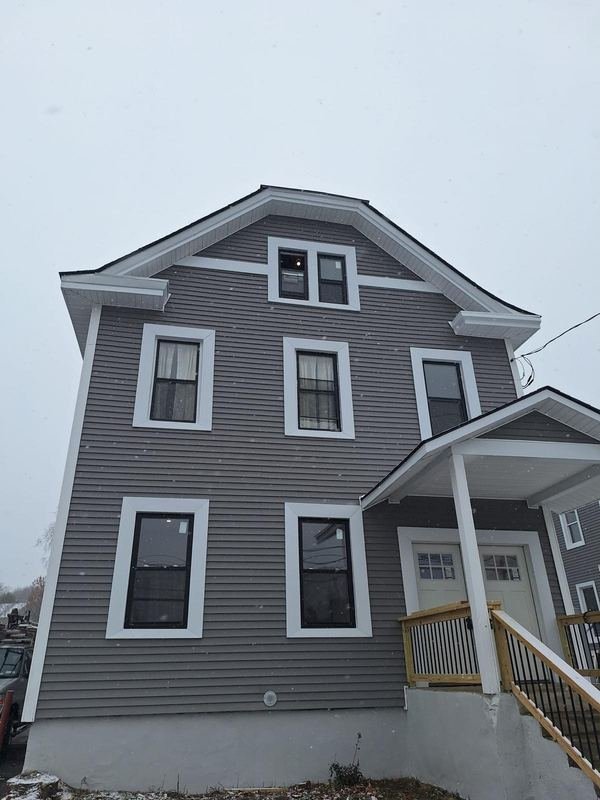 Two-story home with a new roof